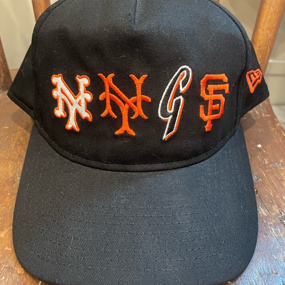 New Era Giants Mets Black and Orange Hat with Team Logo